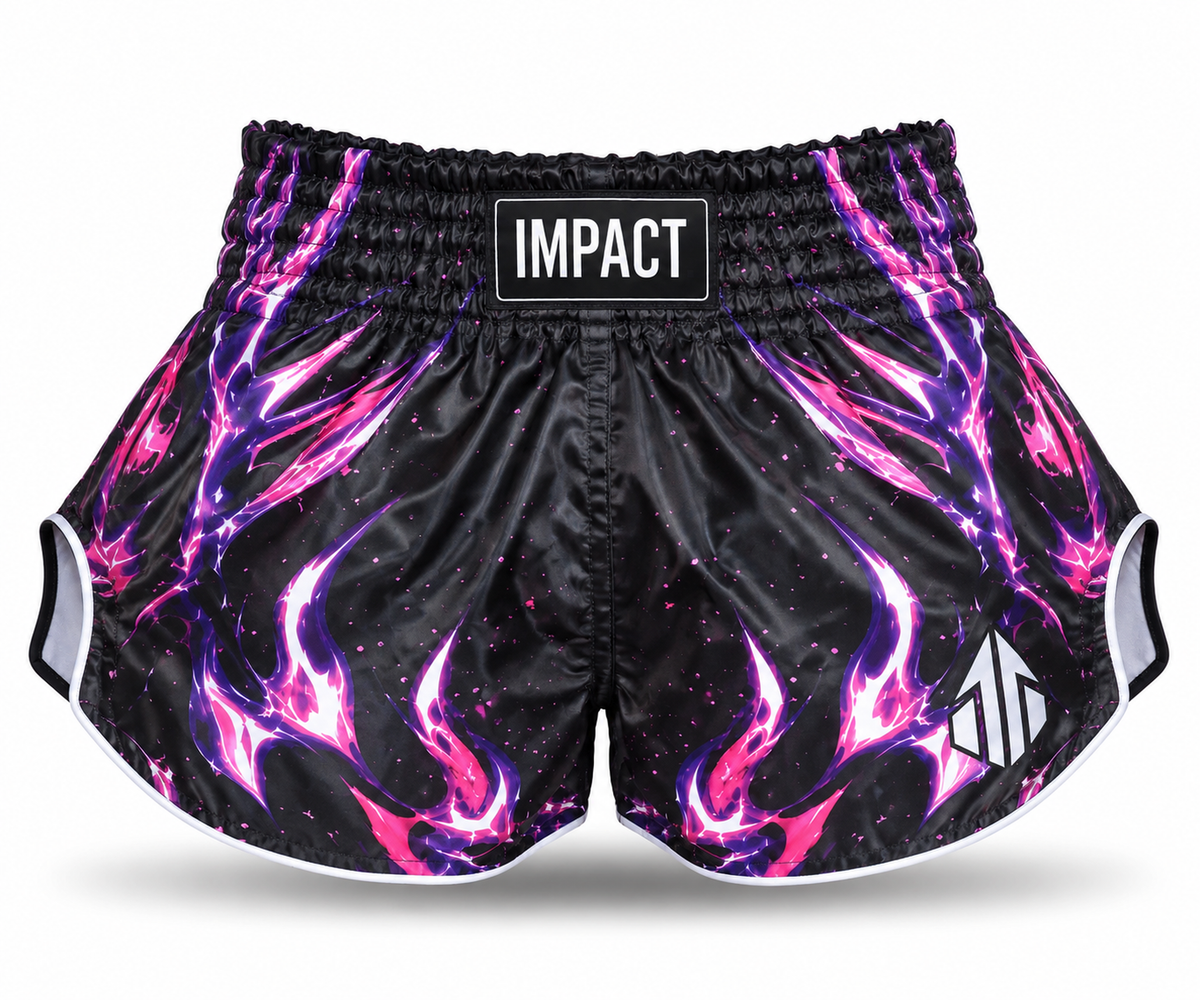 Black and pink IMPACT Muay Thai shorts with magenta-purple flames, high curved hems and centered IMPACT waistband