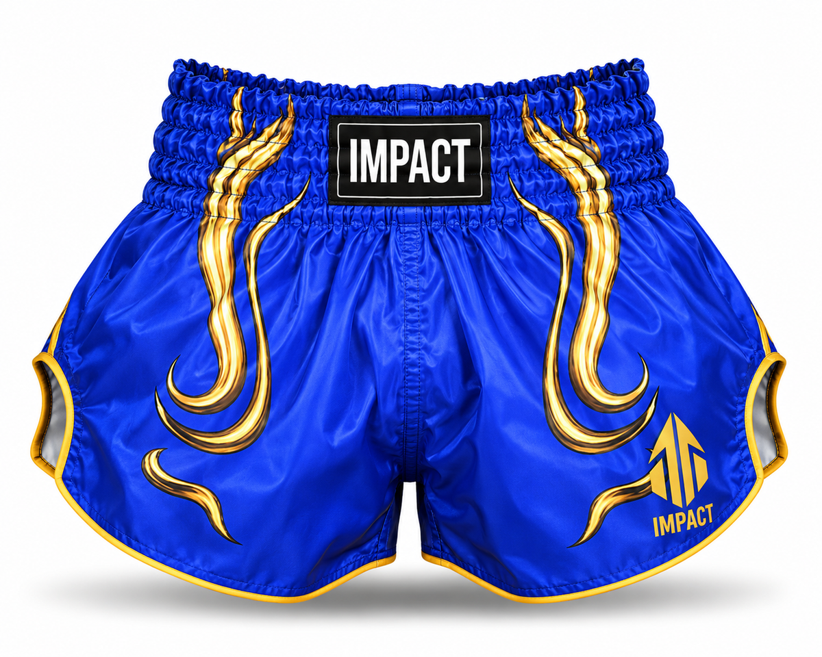 IMPACT royal blue and gold Muay Thai shorts with flame graphics and gold trim
