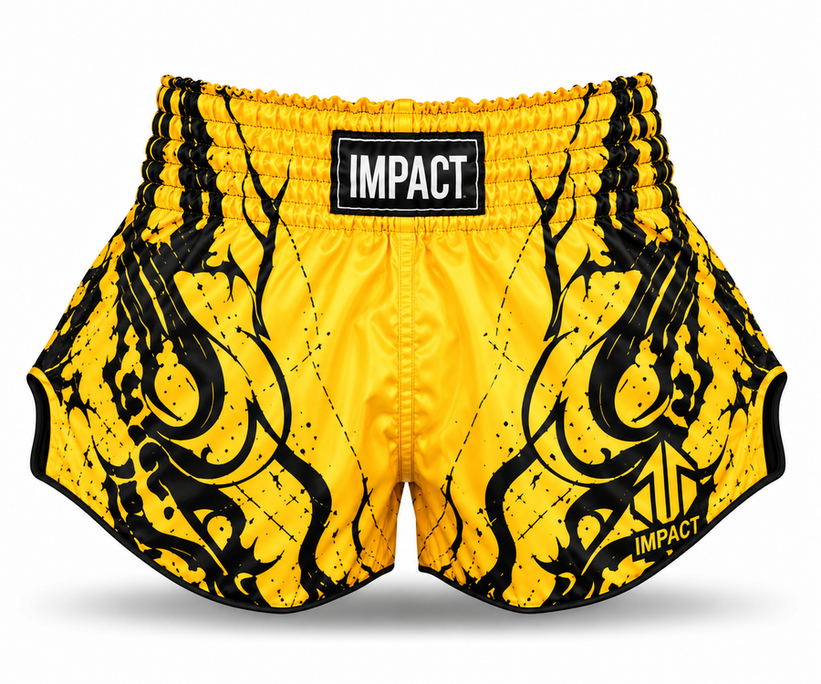 Yellow and black IMPACT Muay Thai shorts with black graphic flourishes and curved high-cut hems